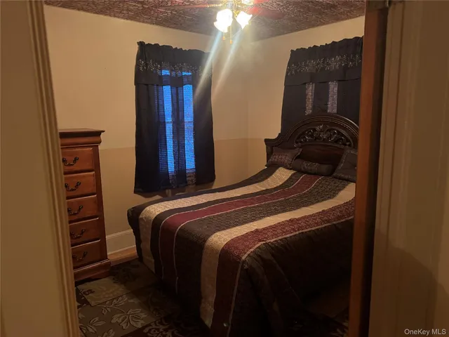 a bedroom with a bed and a closet