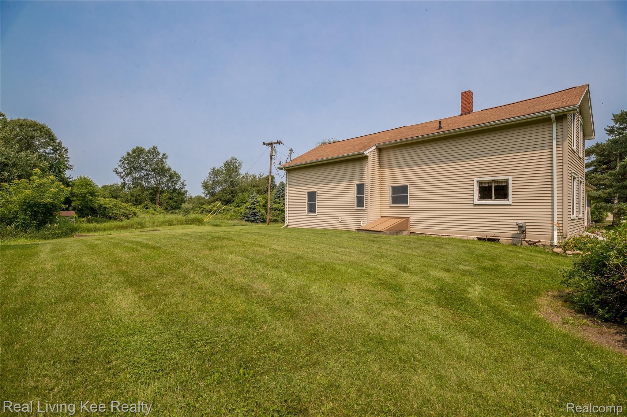 4230 Blood Road Metamora, MI 48455 - Photo 47 of 49 South side of home showing bulkhead to basement