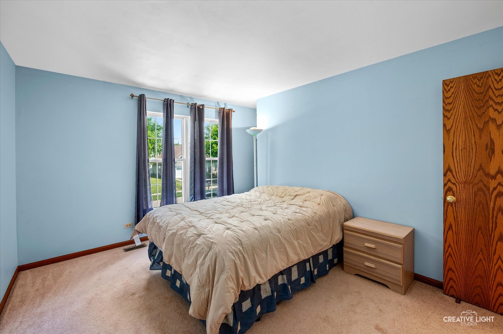 1348 Amaranth Drive Naperville, IL 60564 - Photo 18 of 34 a bed sitting in a bedroom next to a window