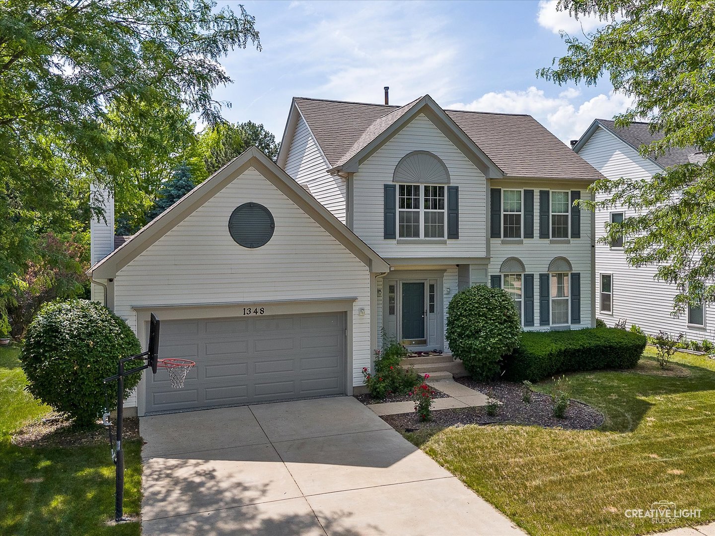 1348 Amaranth Drive Naperville, IL 60564 - Photo 2 of 34 a front view of a house with garden