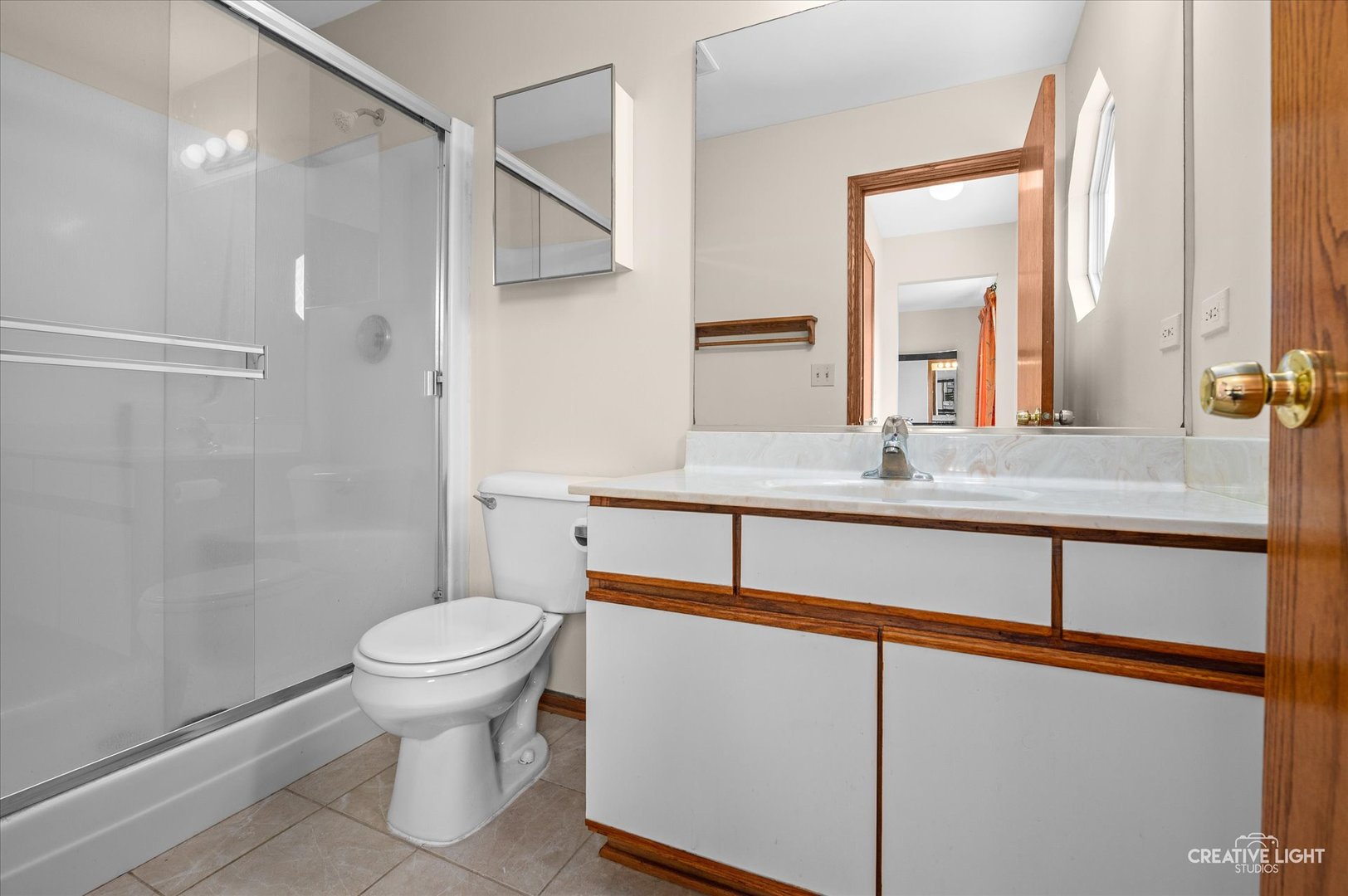 1348 Amaranth Drive Naperville, IL 60564 - Photo 22 of 34 a bathroom with a sink and a mirror