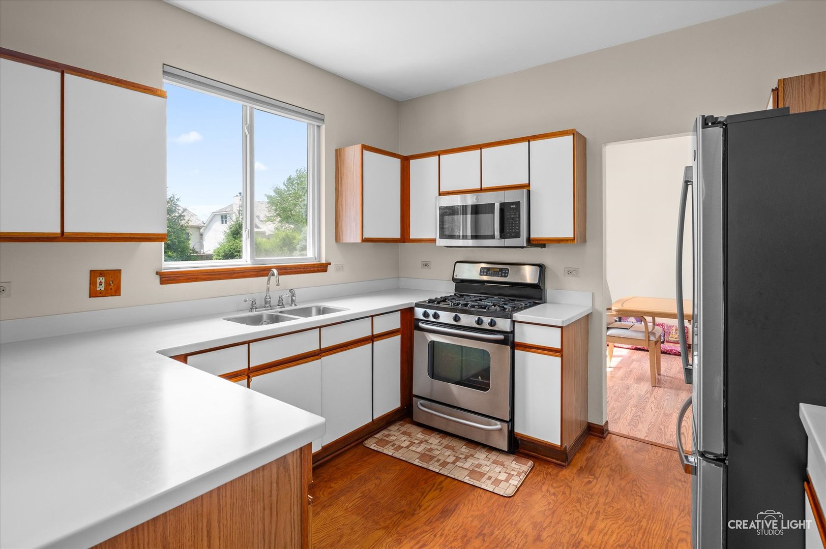 1348 Amaranth Drive Naperville, IL 60564 - Photo 10 of 34 a kitchen with stainless steel appliances granite countertop a refrigerator a sink and a stove