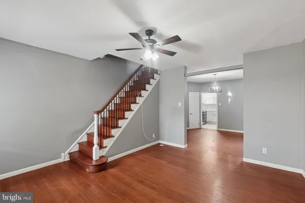 a view of an entryway with wooden floor