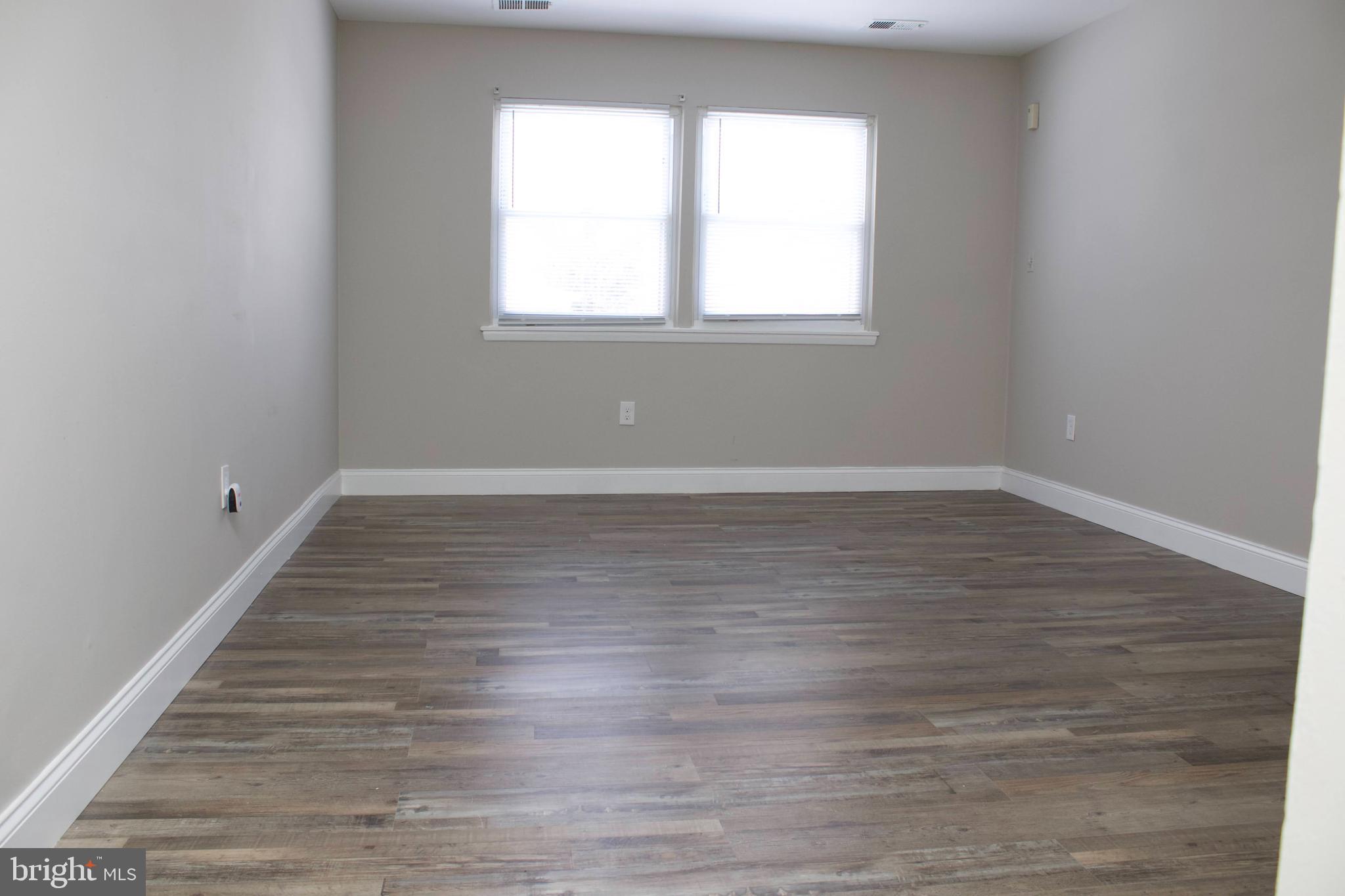 4209 Ridgewood Avenue, Unit 1 Baltimore, MD 21215 - Photo 3 of 9 Spacious living room separate from kitchen