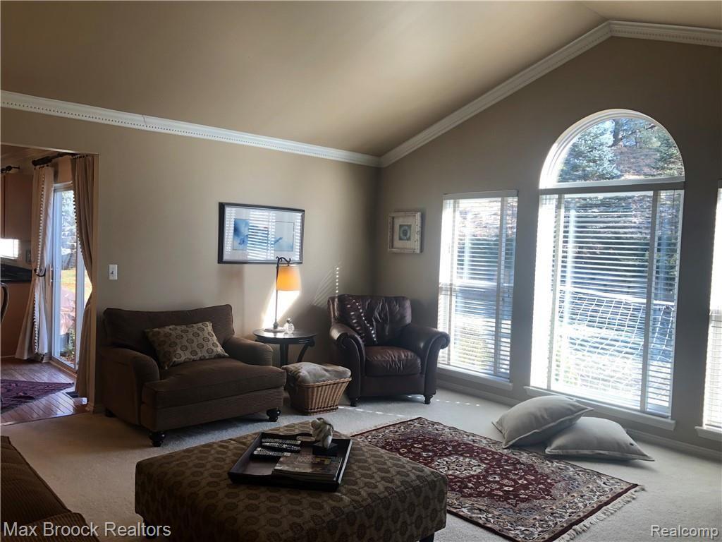 30 Ridge Field Court Oxford, MI 48371 - Photo 17 of 45 Family room - notice the high ceiling and wall of window