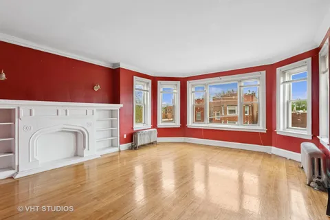 a view of livingroom with furniture a fireplace and wooden floor