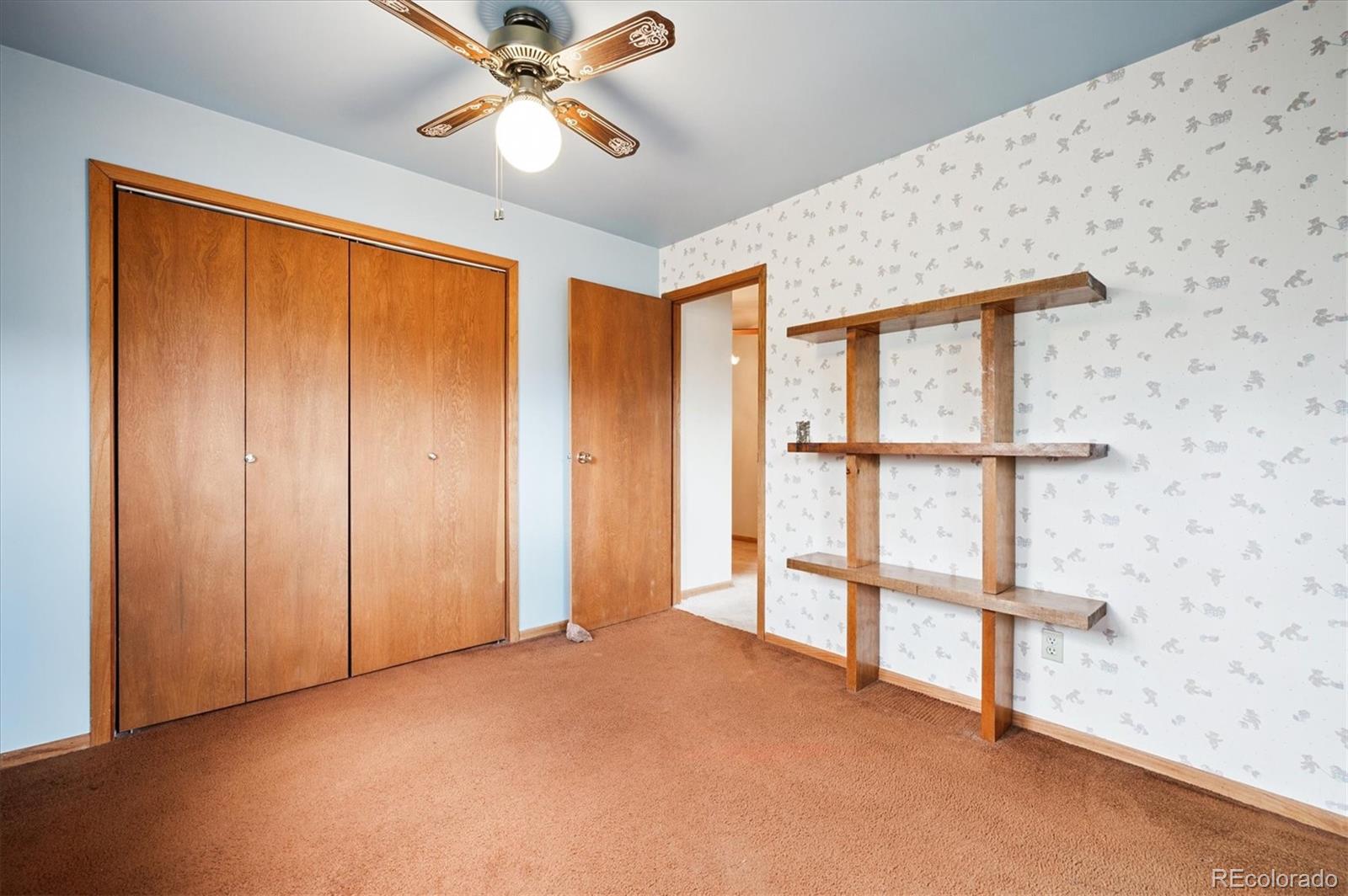33623 Freda Road Pine, CO 80470 - Photo 15 of 27 an empty room with windows and fan
