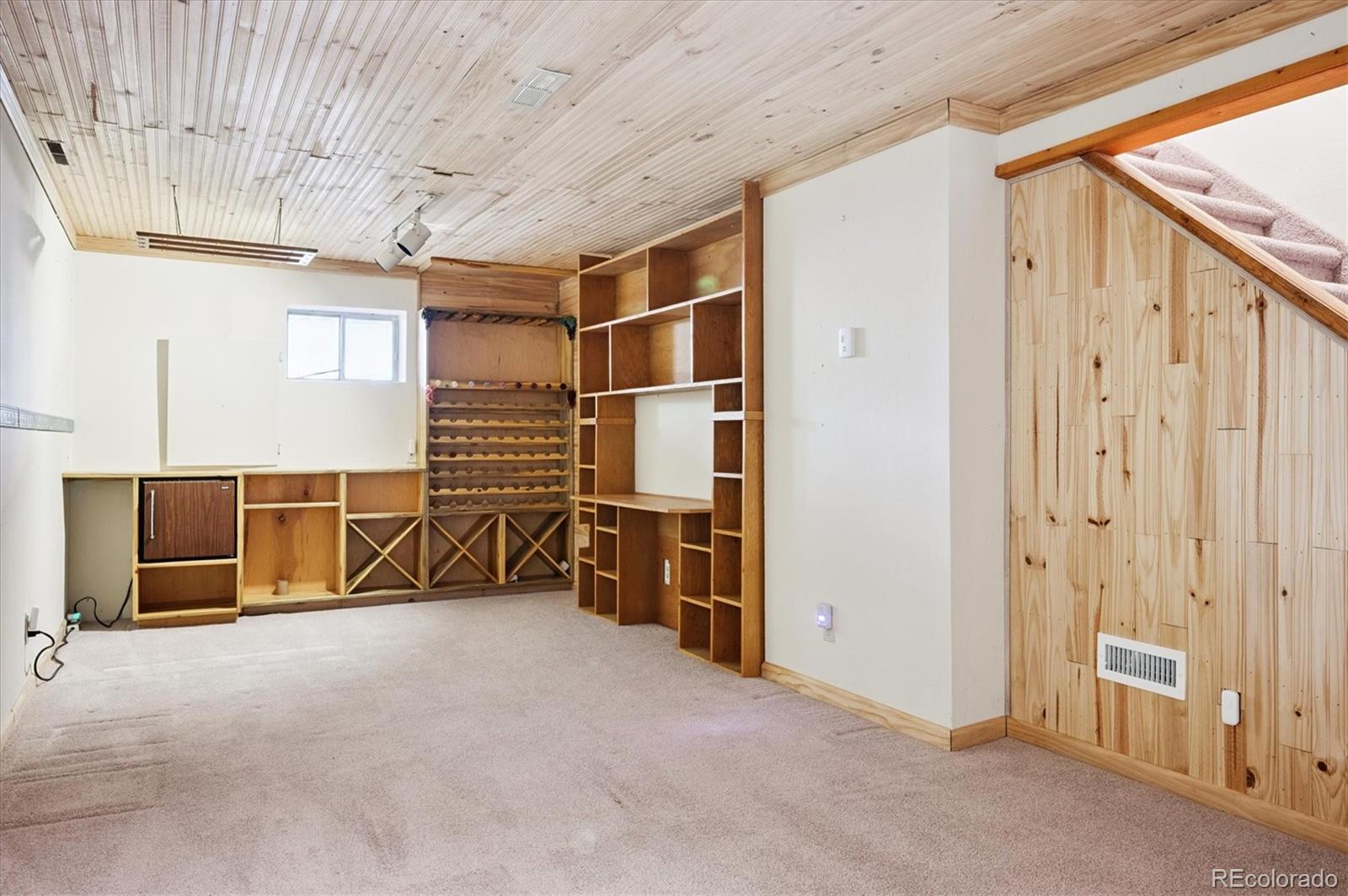 33623 Freda Road Pine, CO 80470 - Photo 17 of 27 an empty room with closet and mirrors