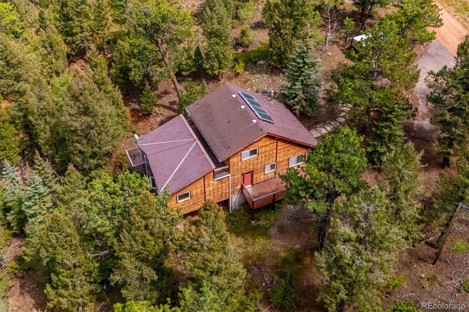 33623 Freda Road Pine, CO 80470 - Photo 20 of 27 an aerial view of a house with yard swimming pool and outdoor seating