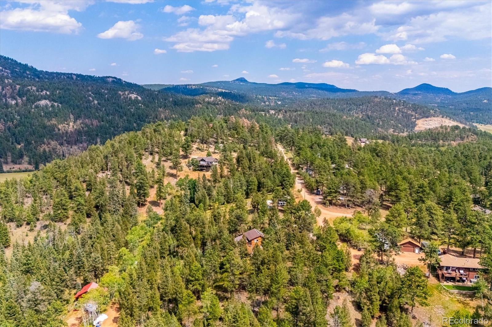 33623 Freda Road Pine, CO 80470 - Photo 23 of 27 a view of a city with mountains in the background