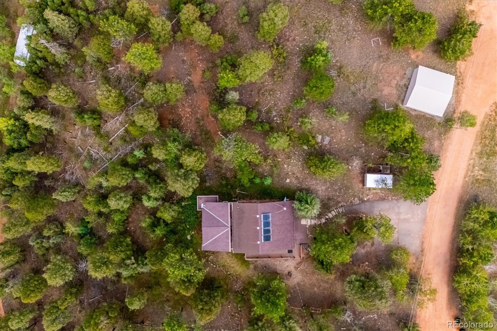 33623 Freda Road Pine, CO 80470 - Photo 25 of 27 an aerial view of a house with yard and garden