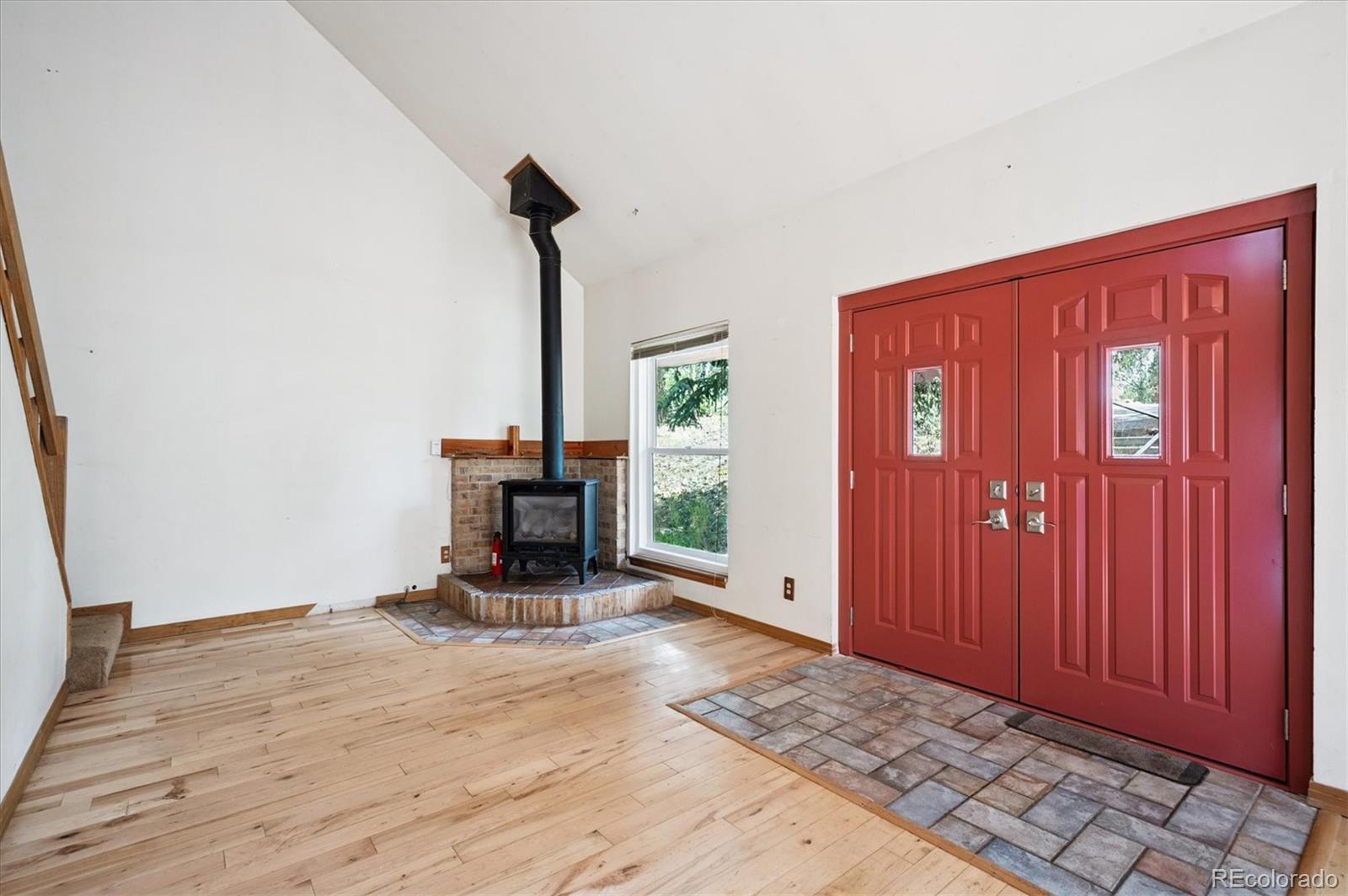 33623 Freda Road Pine, CO 80470 - Photo 3 of 27 a view of empty room with wooden floor