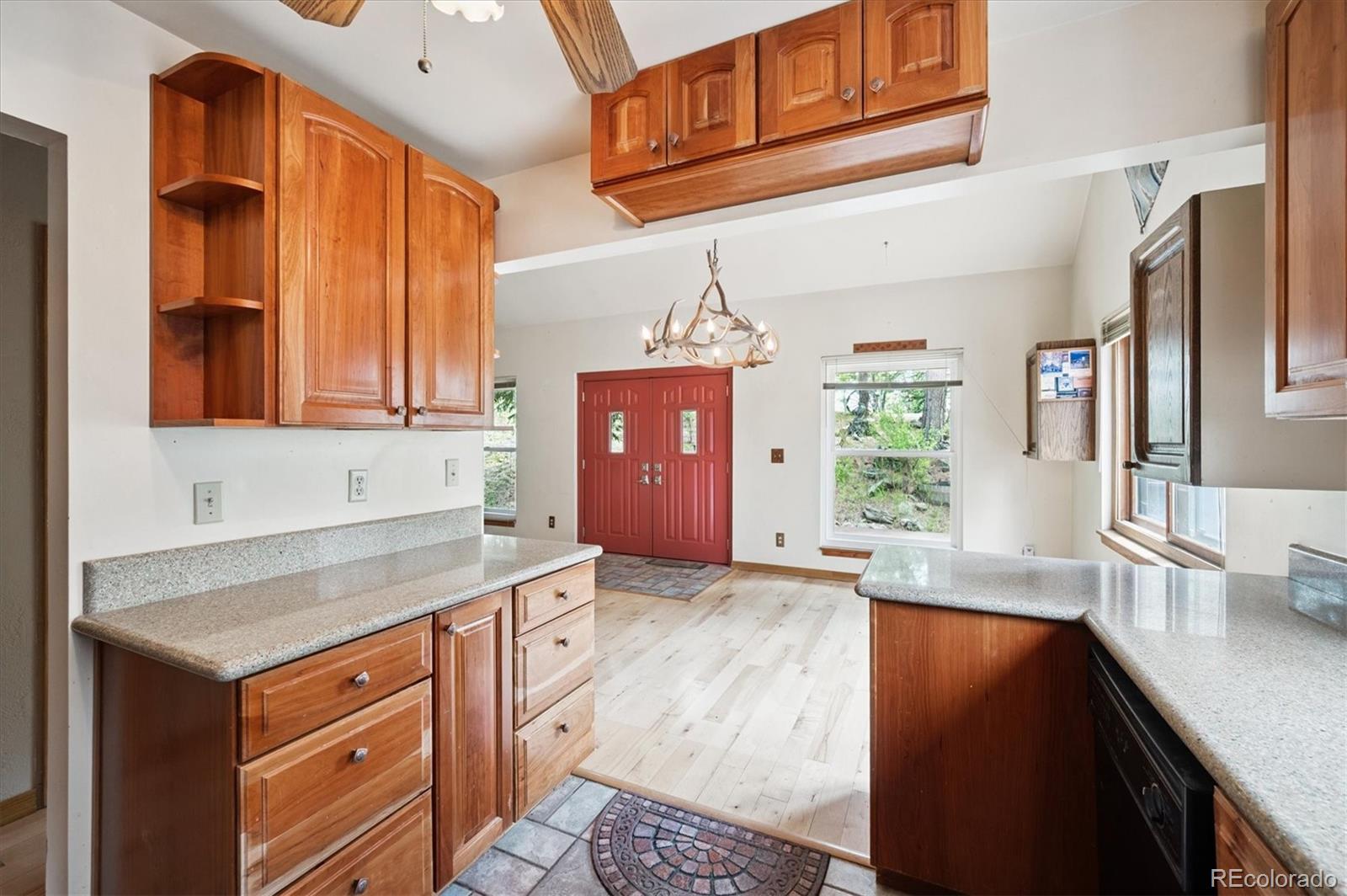 33623 Freda Road Pine, CO 80470 - Photo 6 of 27 a kitchen with stainless steel appliances granite countertop a sink stove and cabinets