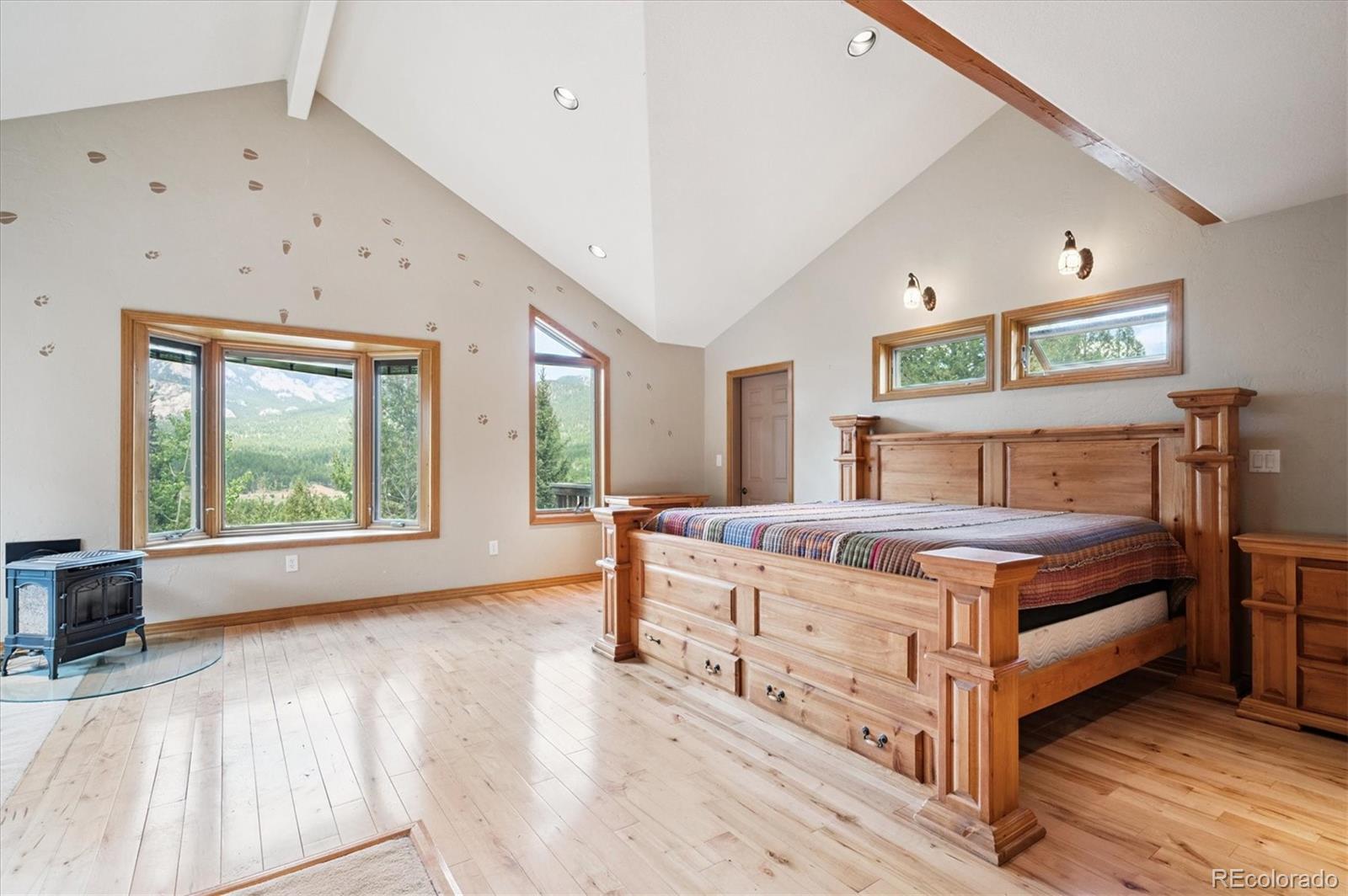 33623 Freda Road Pine, CO 80470 - Photo 8 of 27 a bedroom with a bed and a large window