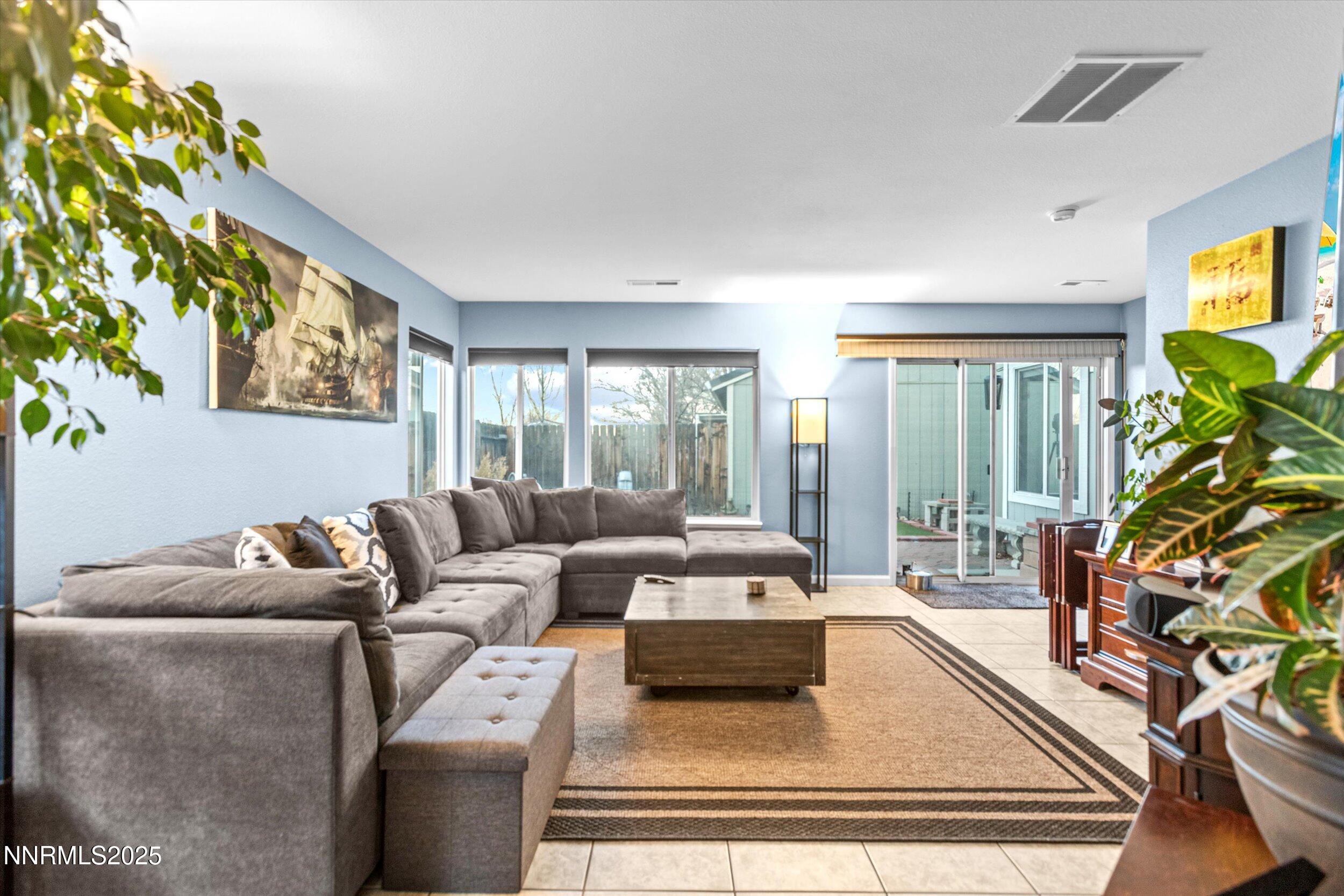 3131 Winter Rose Circle Reno, NV 89502 - Photo 12 of 32 a living room with furniture and a flat screen tv