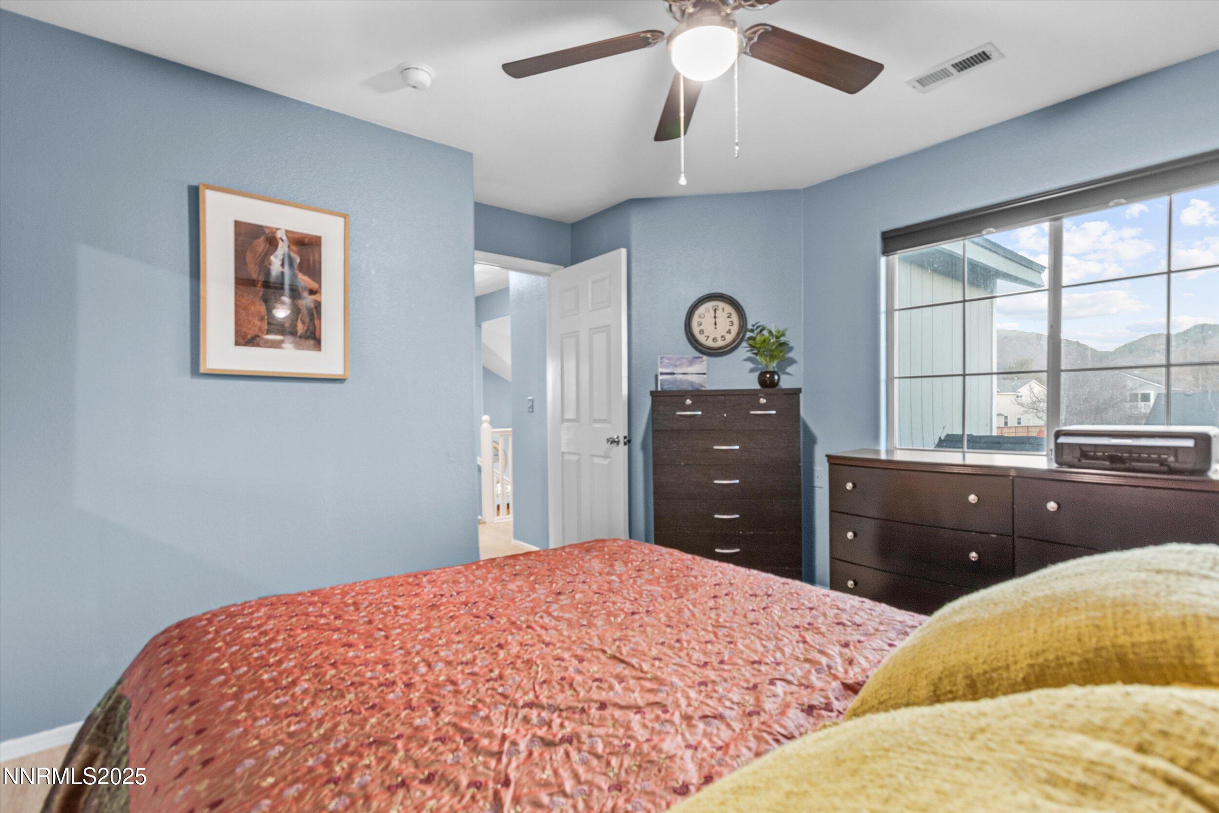 3131 Winter Rose Circle Reno, NV 89502 - Photo 15 of 32 a bedroom with a bed and a dresser