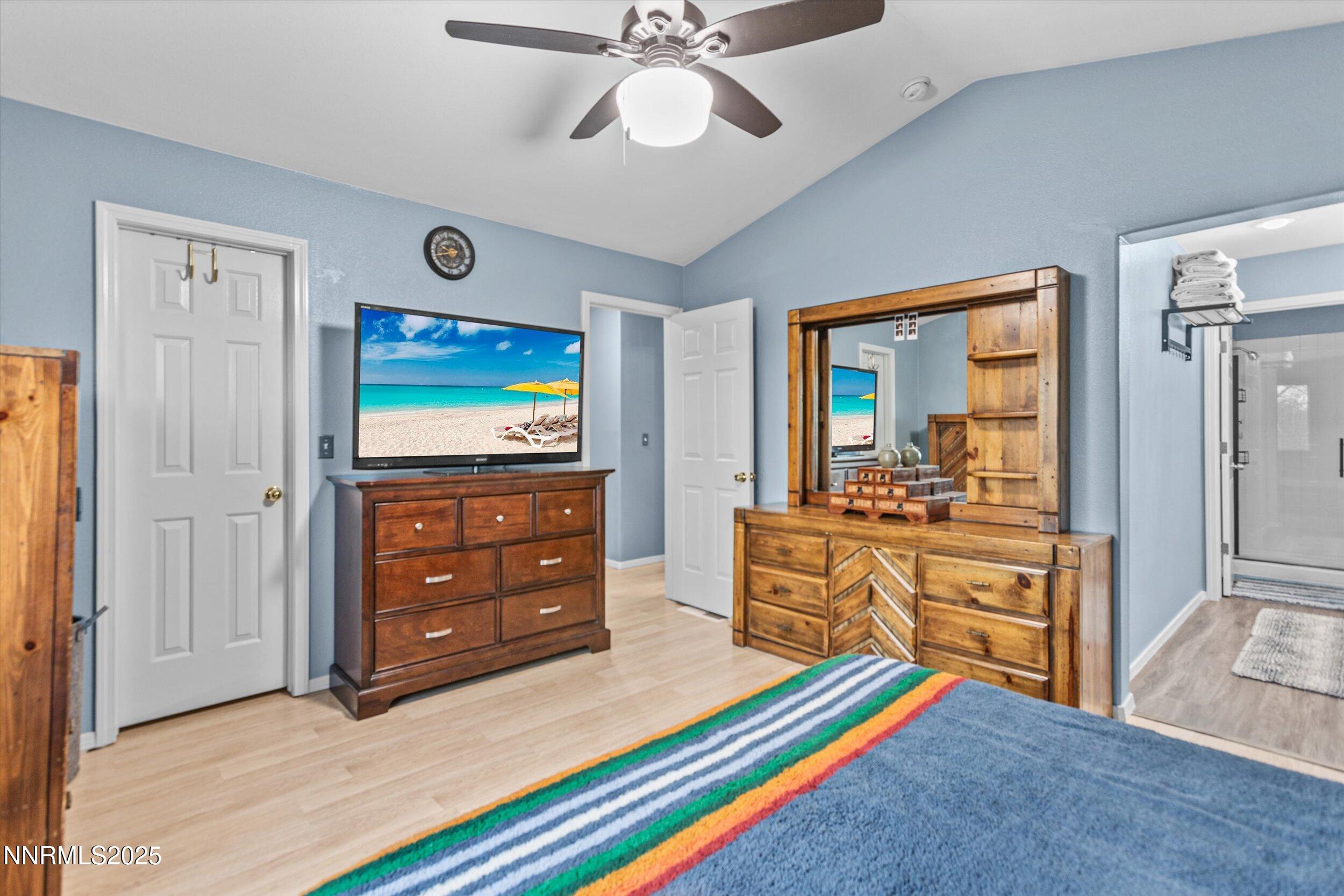 3131 Winter Rose Circle Reno, NV 89502 - Photo 18 of 32 a bedroom with a bed and a dresser in it