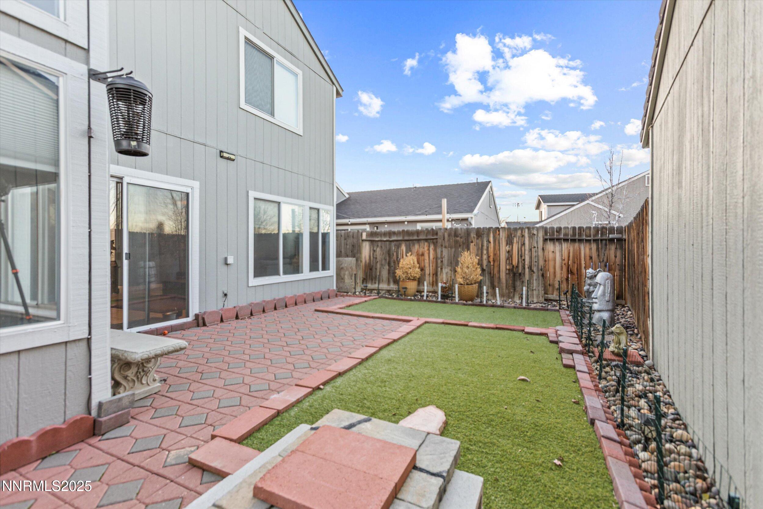 3131 Winter Rose Circle Reno, NV 89502 - Photo 23 of 32 a view of a house with backyard and sitting area