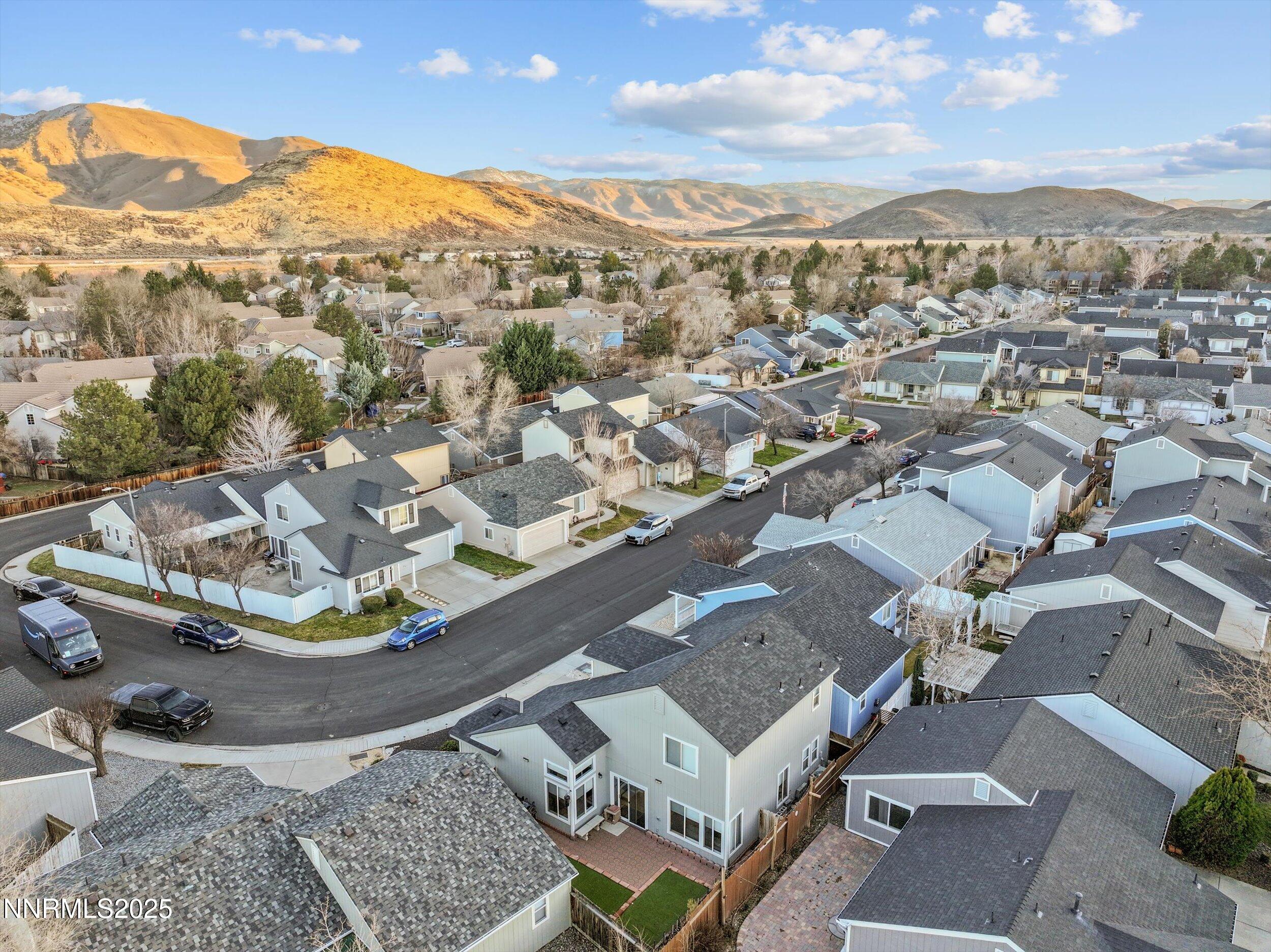3131 Winter Rose Circle Reno, NV 89502 - Photo 31 of 32 an aerial view of a house with a mountain