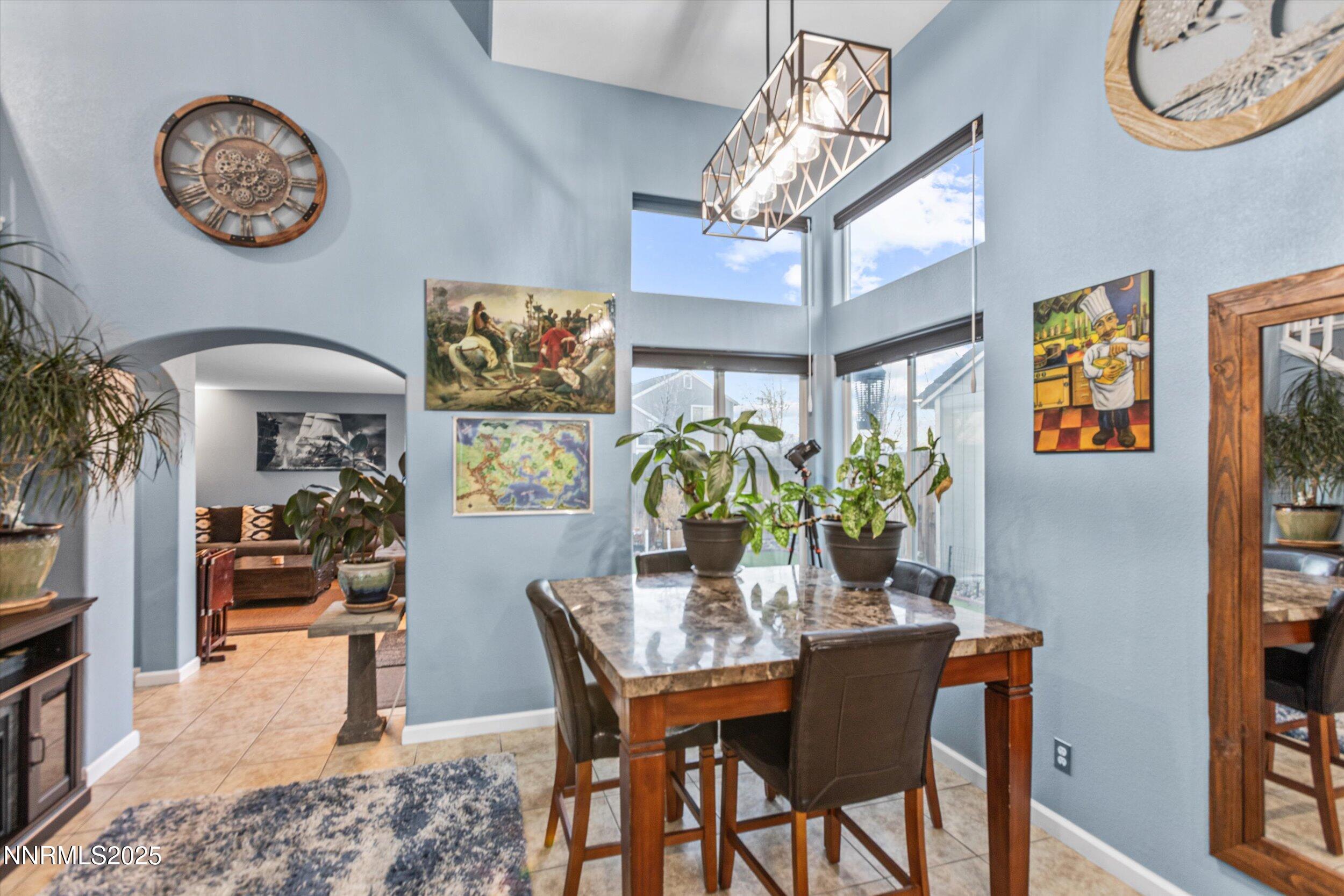 3131 Winter Rose Circle Reno, NV 89502 - Photo 9 of 32 a view of a dining room with furniture and chandelier