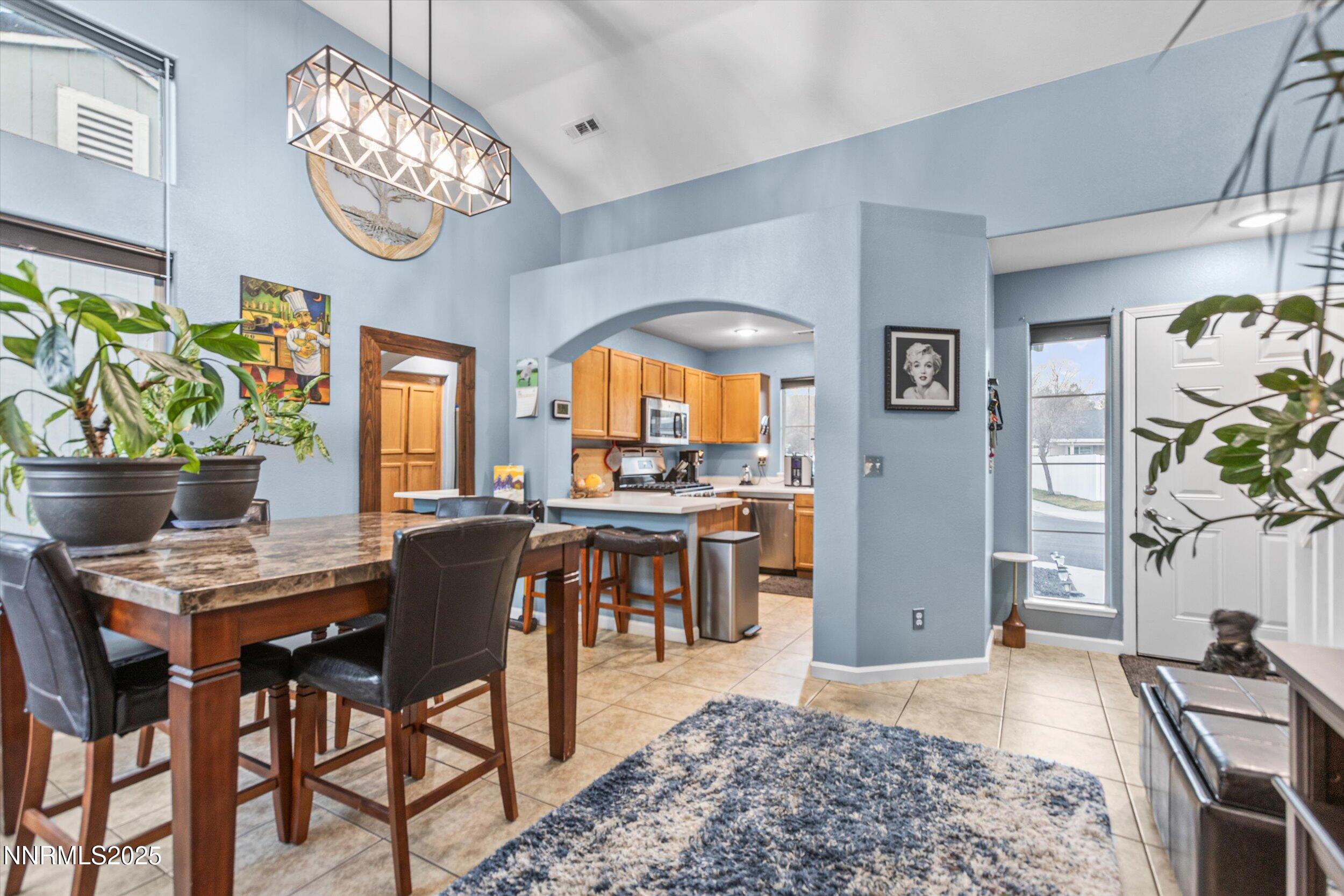 3131 Winter Rose Circle Reno, NV 89502 - Photo 10 of 32 a view of a dining room with furniture and chandelier