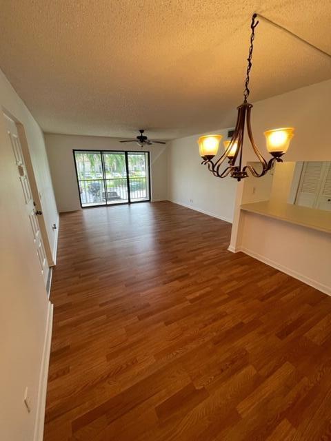 610 Sea Pine Way, Unit A2 Greenacres, FL 33415 - Photo 12 of 13 a view of a room with wooden floor and fan