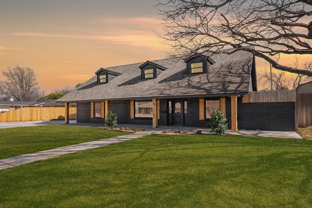 6117 Gainsborough Road Amarillo, TX 79106 - Photo 1 of 40 a front view of a house with a garden