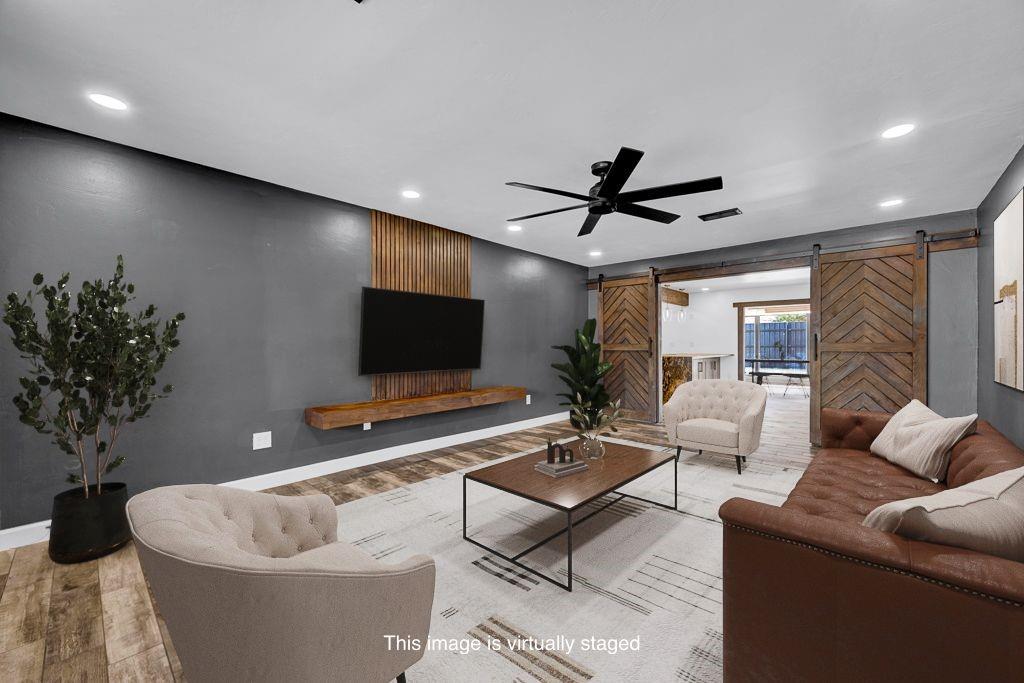 6117 Gainsborough Road Amarillo, TX 79106 - Photo 2 of 40 a living room with furniture and a flat screen tv