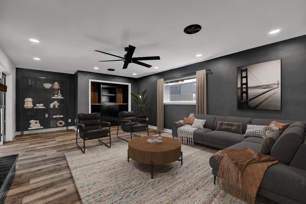 6117 Gainsborough Road Amarillo, TX 79106 - Photo 23 of 40 a living room with furniture and a flat screen tv