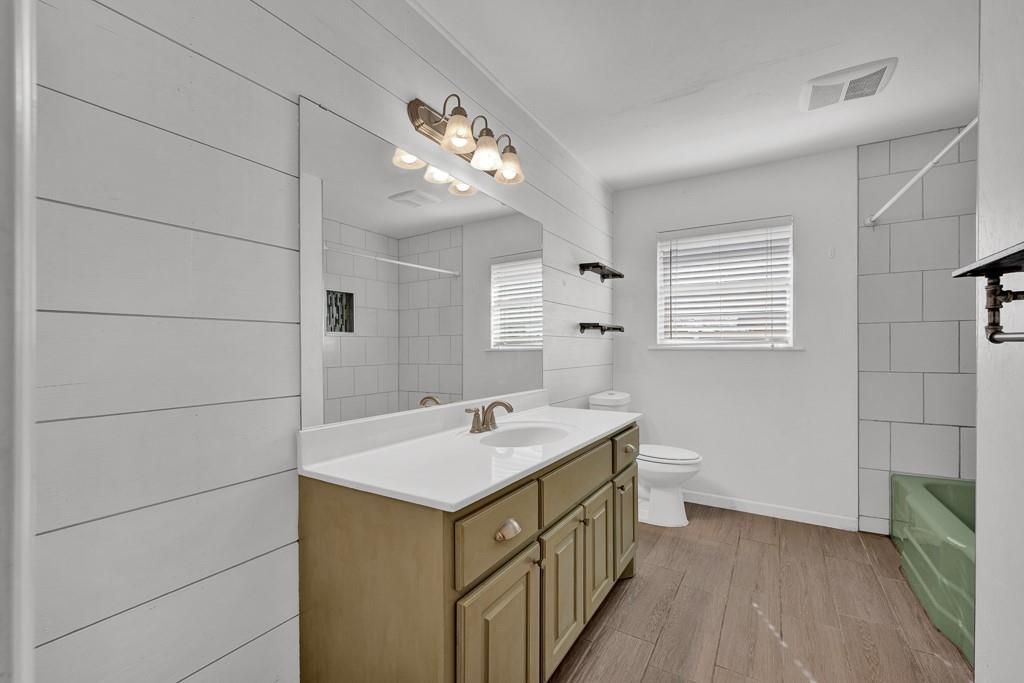 6117 Gainsborough Road Amarillo, TX 79106 - Photo 26 of 40 a bathroom with a sink a vanity and a mirror