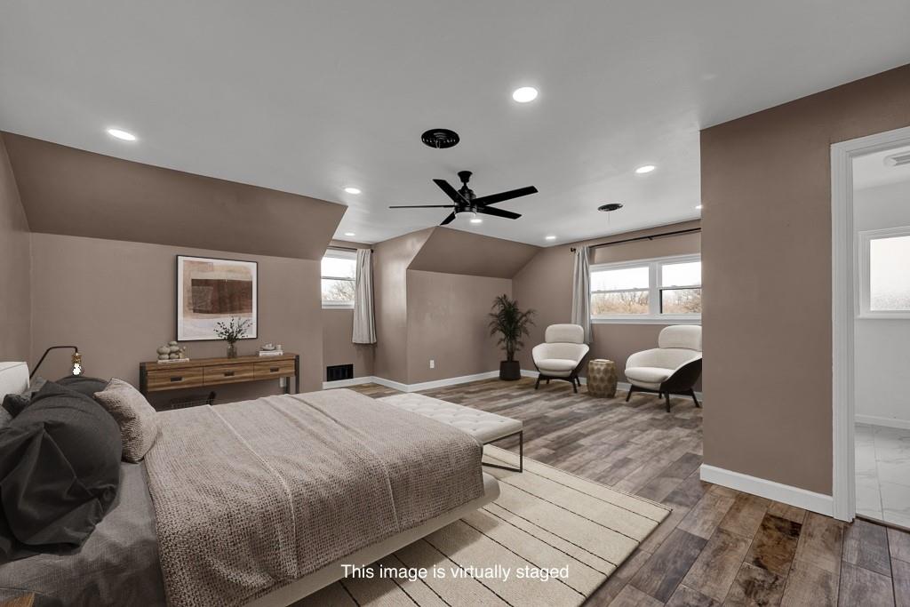 6117 Gainsborough Road Amarillo, TX 79106 - Photo 33 of 40 a bedroom with double bed and a large window