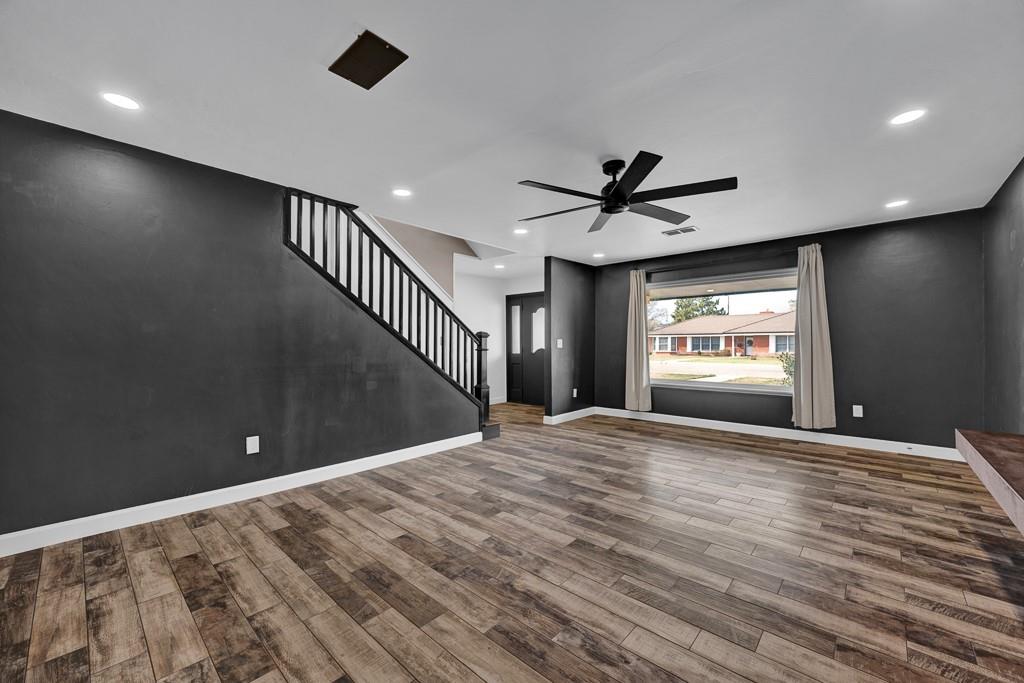 6117 Gainsborough Road Amarillo, TX 79106 - Photo 6 of 40 a view of an empty room with a window