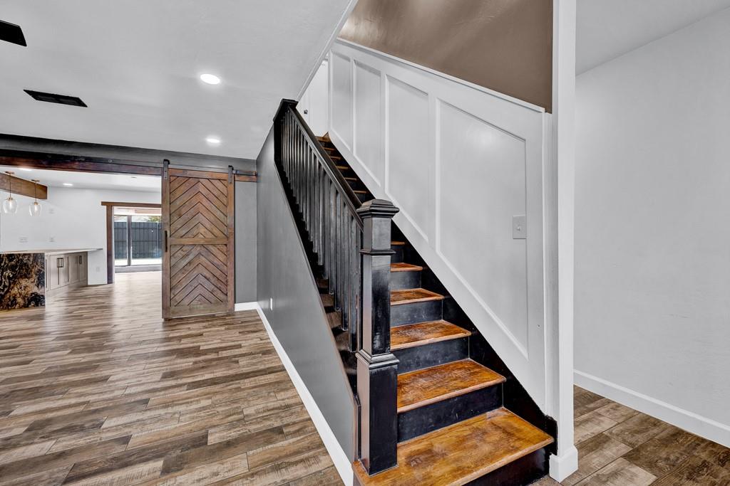 6117 Gainsborough Road Amarillo, TX 79106 - Photo 7 of 40 a view of entryway and hall with wooden floor