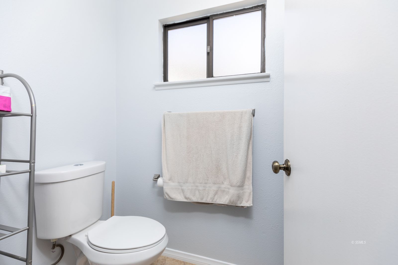 1012 Scott Street Ridgecrest, CA 93555 - Photo 20 of 31 a white toilet sitting next to a bathroom sink