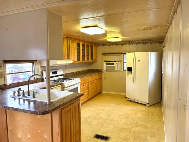 a view of a kitchen with a sink