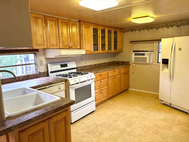 a kitchen that has a sink and a stove