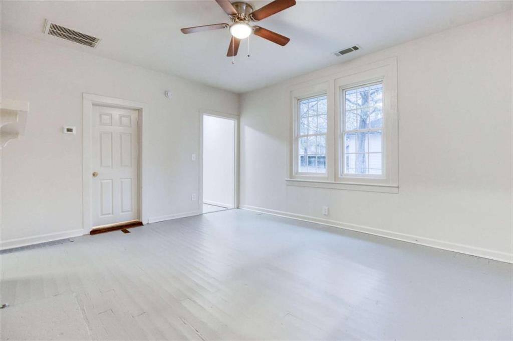 126 6th Street Monroe, GA 30655 - Photo 13 of 24 a view of an empty room with a window