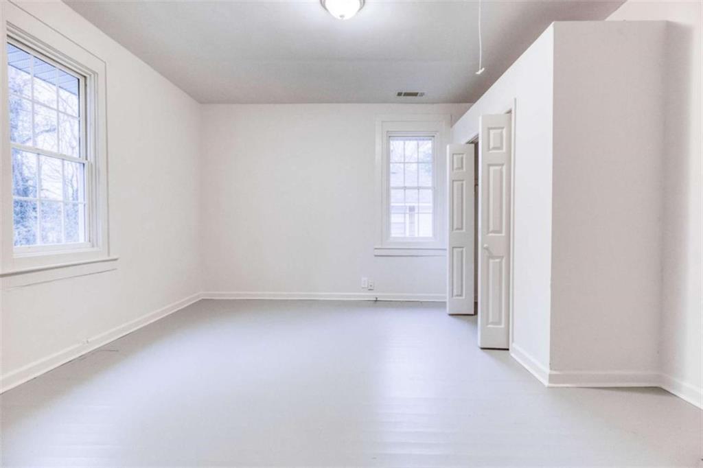 126 6th Street Monroe, GA 30655 - Photo 14 of 24 an empty room with windows