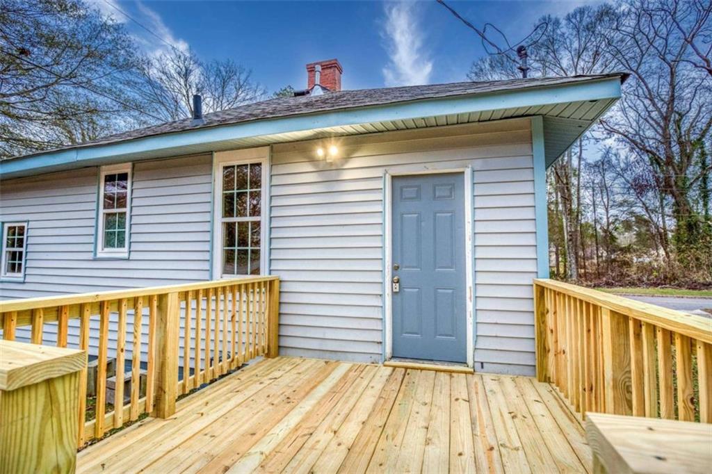 126 6th Street Monroe, GA 30655 - Photo 23 of 24 a view of a house with wooden deck