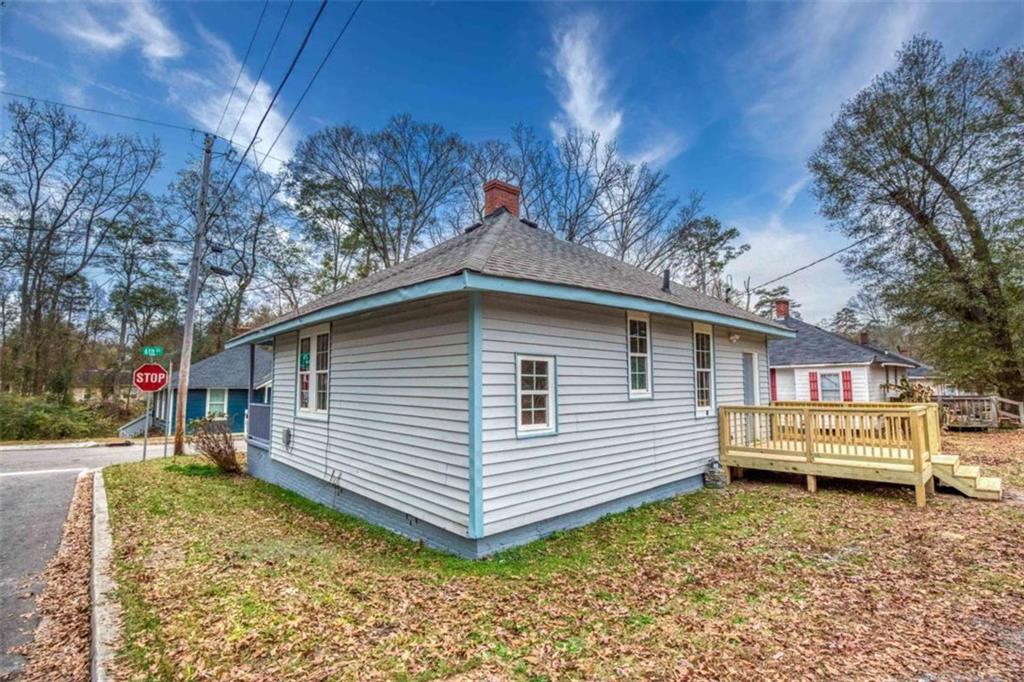 126 6th Street Monroe, GA 30655 - Photo 8 of 24 a front view of a house with garden