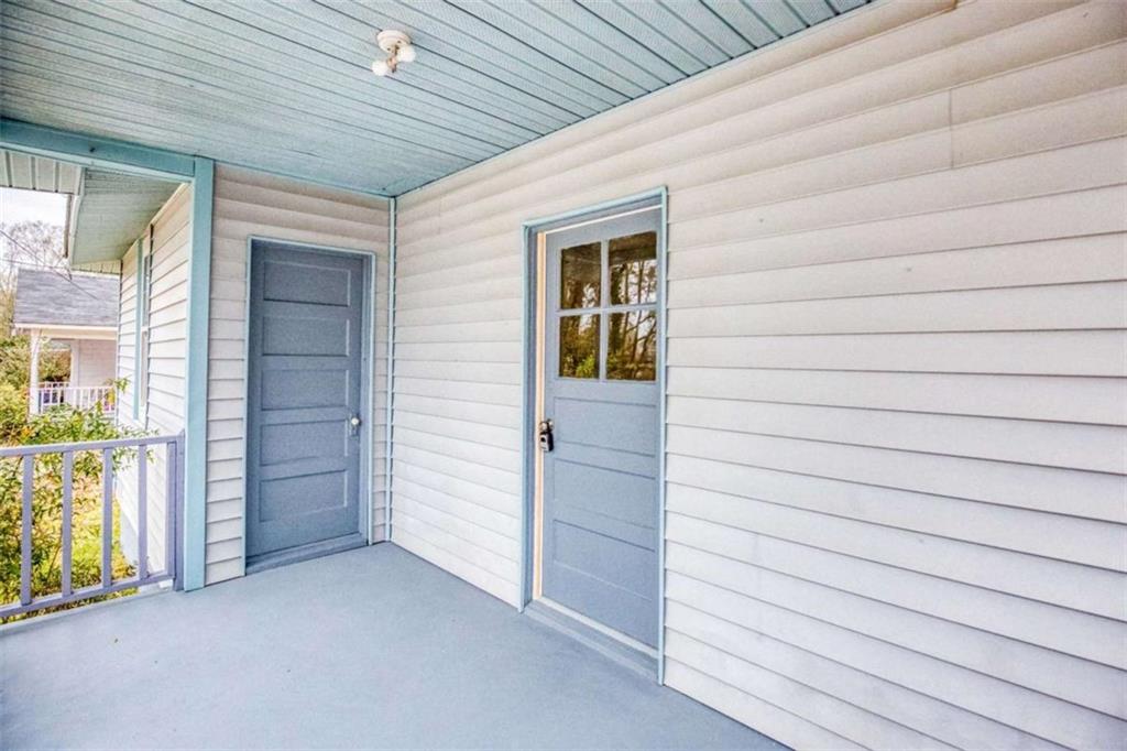 126 6th Street Monroe, GA 30655 - Photo 9 of 24 a view of an empty room and fire place