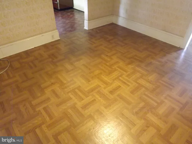 a view of a room with a wooden floor