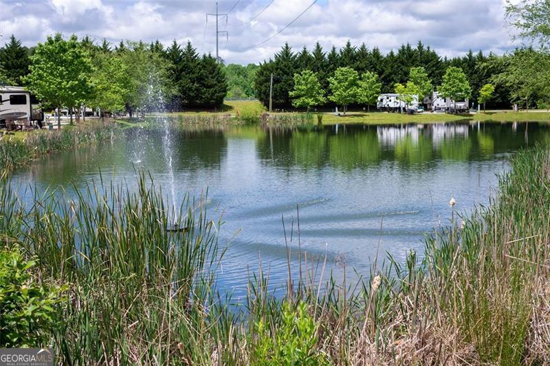 121 Mountain Meadows Morganton, GA 30560 - Photo 16 of 28 a view of a lake with a building in the background