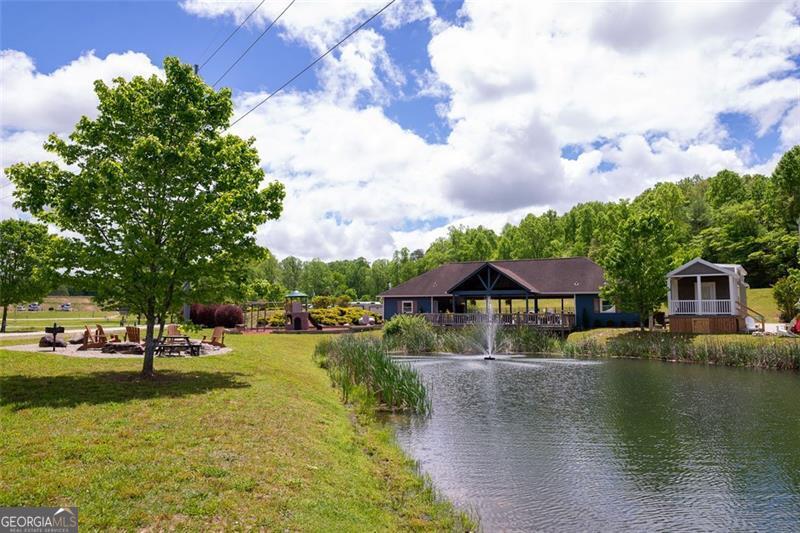 121 Mountain Meadows Morganton, GA 30560 - Photo 18 of 28 a view of a lake with a house in the background