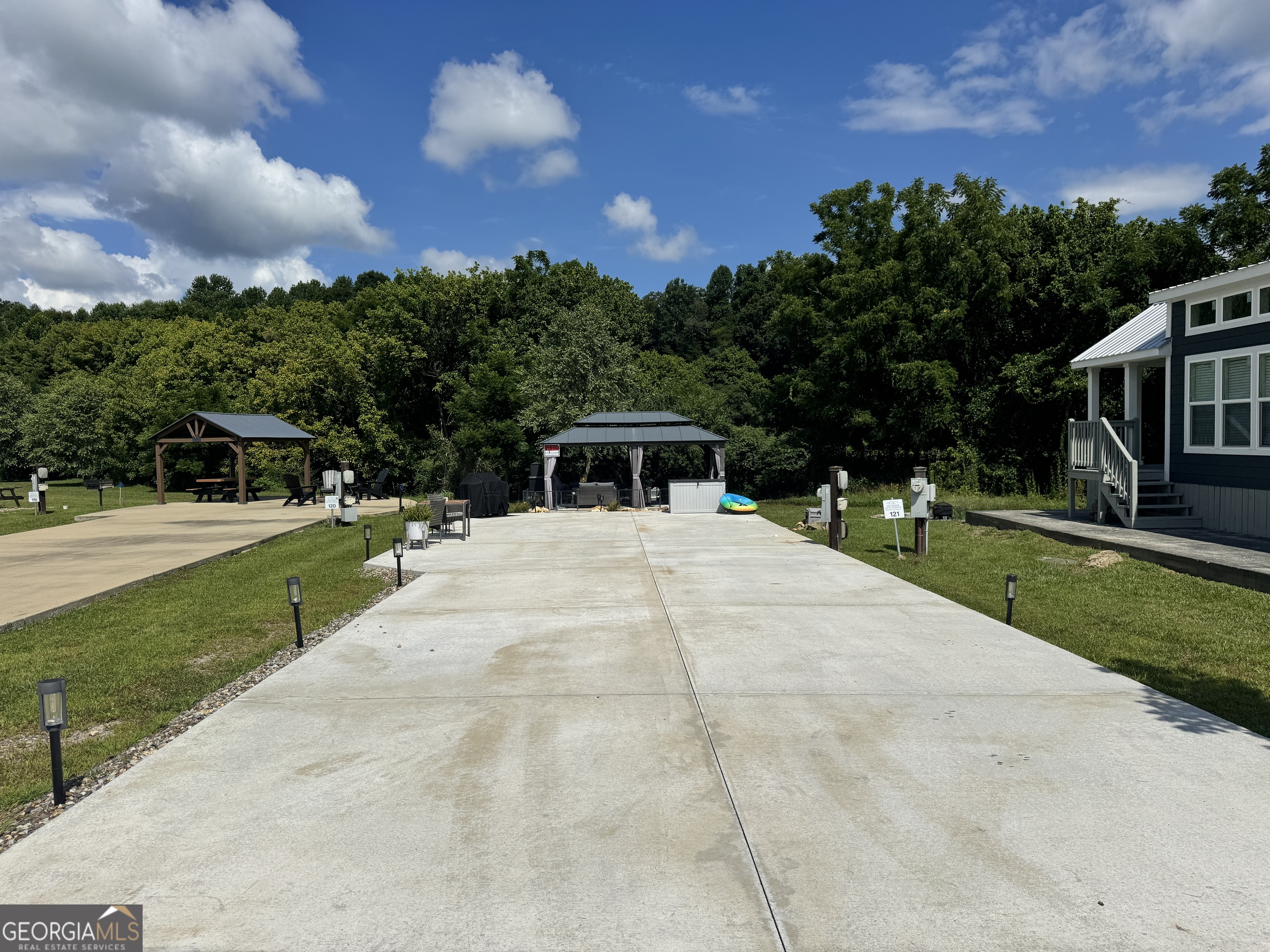 121 Mountain Meadows Morganton, GA 30560 - Photo 2 of 28 a house view with a garden space