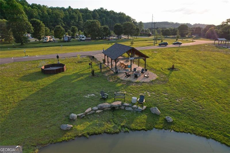 121 Mountain Meadows Morganton, GA 30560 - Photo 21 of 28 a view of a lake with lawn chairs