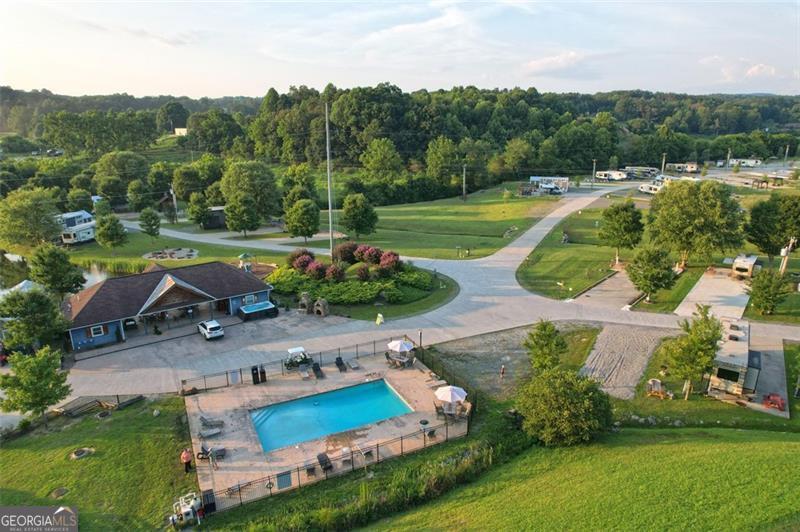 121 Mountain Meadows Morganton, GA 30560 - Photo 23 of 28 an aerial view of a house with a garden and swimming pool