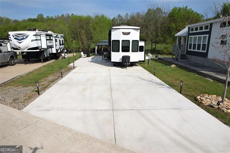 121 Mountain Meadows Morganton, GA 30560 - Photo 5 of 28 a front view of a house with a yard
