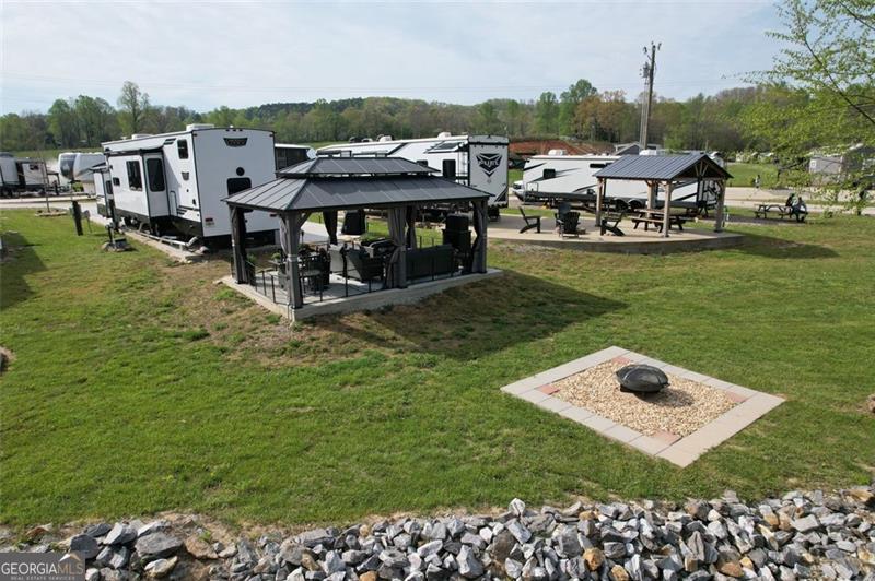 121 Mountain Meadows Morganton, GA 30560 - Photo 8 of 28 a view of a house with a yard and sitting area