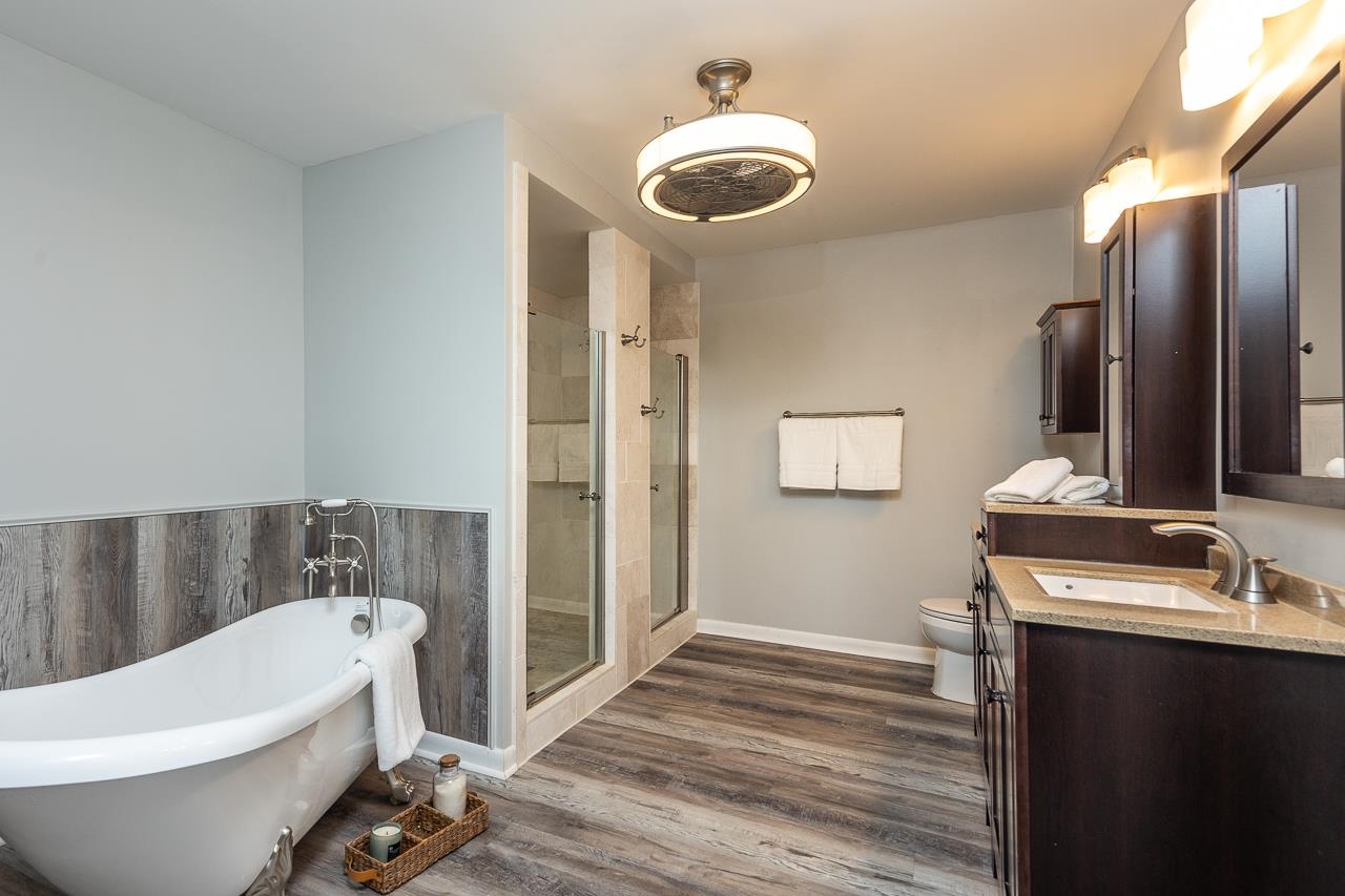 3620 Oak Road Bartlett, TN 38135 - Photo 13 of 28 Luxurious primary bathroom showcases a clawfoot tub, double walk through shower w lovely tilework and double vanities